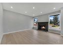 19 Deer Lane Road Se, Calgary, AB  - Indoor Photo Showing Other Room With Fireplace 