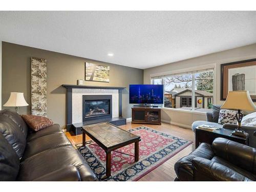 77 Shannon Circle Sw, Calgary, AB - Indoor Photo Showing Living Room With Fireplace