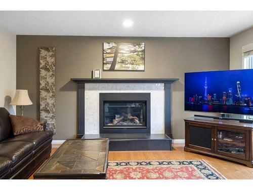 77 Shannon Circle Sw, Calgary, AB - Indoor Photo Showing Living Room With Fireplace