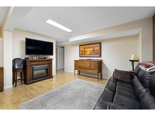 77 Shannon Circle Sw, Calgary, AB - Indoor Photo Showing Living Room With Fireplace