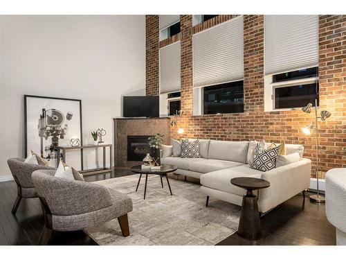 107-1117 1 Street Sw, Calgary, AB - Indoor Photo Showing Living Room With Fireplace