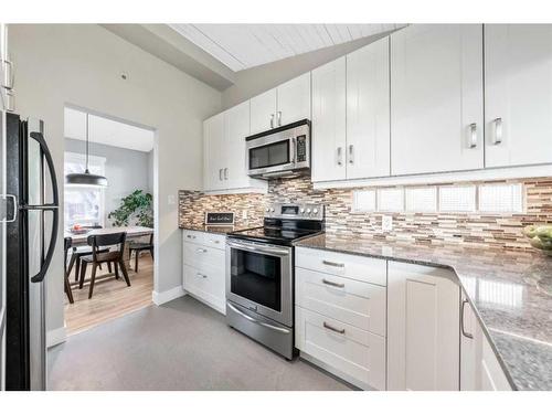 21 Holden Road Sw, Calgary, AB - Indoor Photo Showing Kitchen With Stainless Steel Kitchen With Upgraded Kitchen