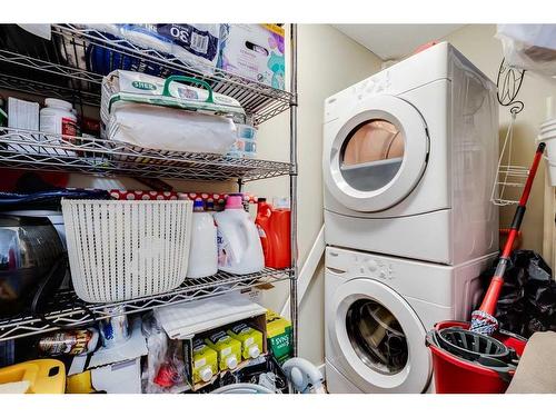 102-7110 80 Avenue Ne, Calgary, AB - Indoor Photo Showing Laundry Room