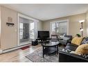 102-7110 80 Avenue Ne, Calgary, AB  - Indoor Photo Showing Living Room 