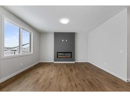 249 Savanna Drive Ne, Calgary, AB - Indoor Photo Showing Living Room With Fireplace