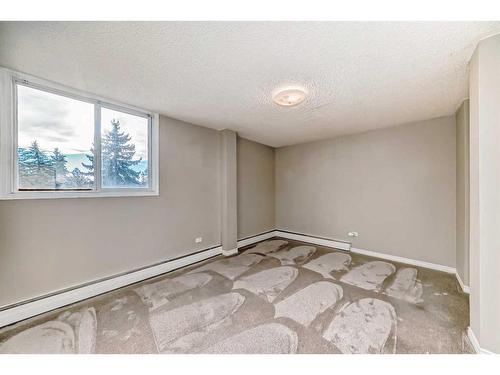 103-312 Cedar Crescent Sw, Calgary, AB - Indoor Photo Showing Other Room