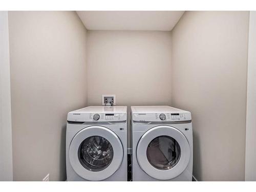 163 Mill Road, Cochrane, AB - Indoor Photo Showing Laundry Room