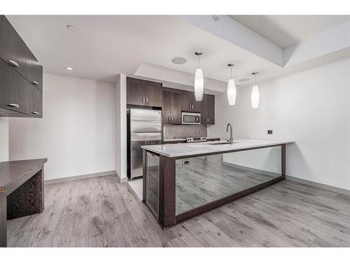 303-530 12 Avenue Sw, Calgary, AB - Indoor Photo Showing Kitchen With Stainless Steel Kitchen