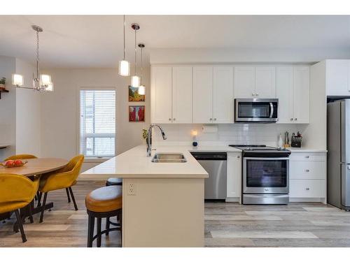 302-15 Evanscrest Park Nw, Calgary, AB - Indoor Photo Showing Kitchen With Stainless Steel Kitchen With Double Sink With Upgraded Kitchen