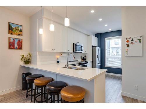 302-15 Evanscrest Park Nw, Calgary, AB - Indoor Photo Showing Kitchen With Stainless Steel Kitchen With Double Sink With Upgraded Kitchen