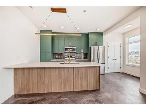 25 Cobbleridge Place, Airdrie, AB - Indoor Photo Showing Kitchen With Upgraded Kitchen