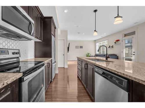 146 Savanna Walk Ne, Calgary, AB - Indoor Photo Showing Kitchen With Stainless Steel Kitchen With Double Sink With Upgraded Kitchen