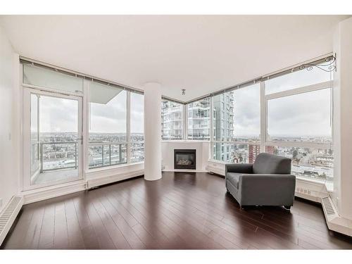 1706-77 Spruce Place Sw, Calgary, AB - Indoor Photo Showing Living Room With Fireplace