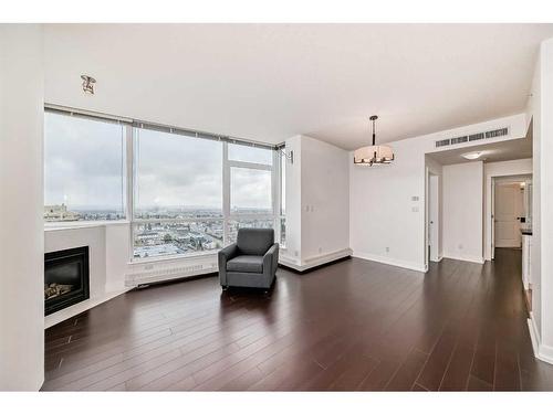 1706-77 Spruce Place Sw, Calgary, AB - Indoor Photo Showing Living Room With Fireplace