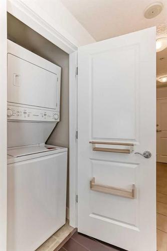 1706-77 Spruce Place Sw, Calgary, AB - Indoor Photo Showing Laundry Room