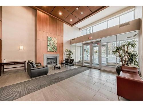 1706-77 Spruce Place Sw, Calgary, AB - Indoor Photo Showing Other Room With Fireplace