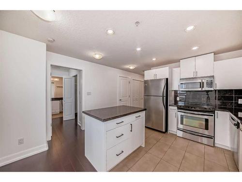 1706-77 Spruce Place Sw, Calgary, AB - Indoor Photo Showing Kitchen With Stainless Steel Kitchen