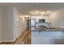 422 Cranbrook Square Se, Calgary, AB  - Indoor Photo Showing Kitchen With Double Sink 