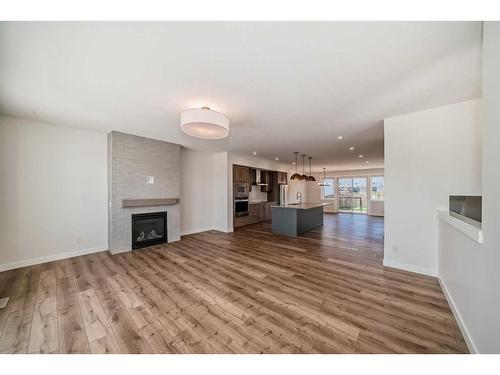 205 Precedence View, Cochrane, AB - Indoor Photo Showing Living Room With Fireplace