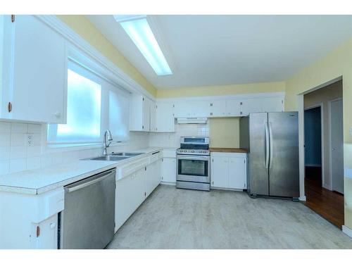 2403 54 Avenue Sw, Calgary, AB - Indoor Photo Showing Kitchen With Stainless Steel Kitchen With Double Sink