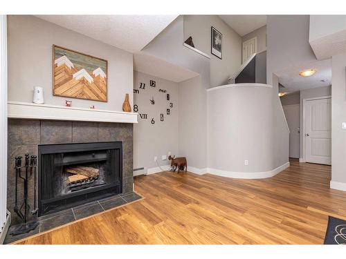 9-122 Village Heights Sw, Calgary, AB - Indoor Photo Showing Living Room With Fireplace