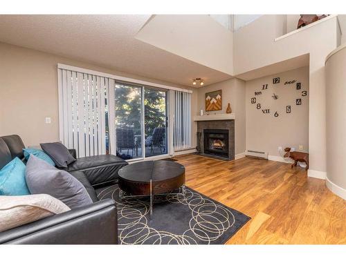 9-122 Village Heights Sw, Calgary, AB - Indoor Photo Showing Living Room With Fireplace