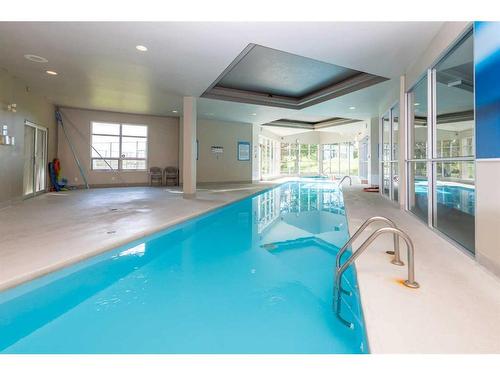 9-122 Village Heights Sw, Calgary, AB - Indoor Photo Showing Other Room With In Ground Pool