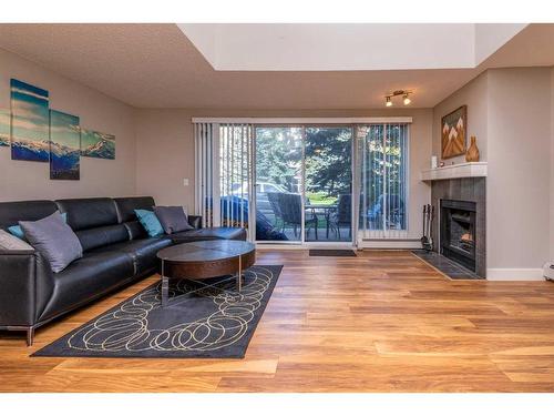 9-122 Village Heights Sw, Calgary, AB - Indoor Photo Showing Living Room With Fireplace