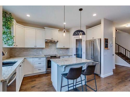 25 Willow Close, Cochrane, AB - Indoor Photo Showing Kitchen With Stainless Steel Kitchen With Upgraded Kitchen