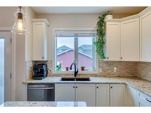 25 Willow Close, Cochrane, AB - Indoor Photo Showing Kitchen With Double Sink