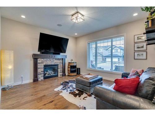 25 Willow Close, Cochrane, AB - Indoor Photo Showing Living Room With Fireplace