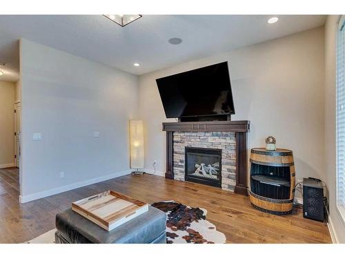 25 Willow Close, Cochrane, AB - Indoor Photo Showing Living Room With Fireplace