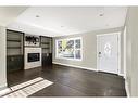 2299 Flanders Avenue Sw, Calgary, AB  - Indoor Photo Showing Living Room With Fireplace 