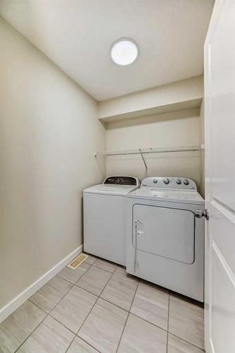 116 Savanna Road Ne, Calgary, AB - Indoor Photo Showing Laundry Room