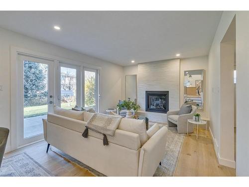 10727 Willowfern Drive Se, Calgary, AB - Indoor Photo Showing Living Room With Fireplace