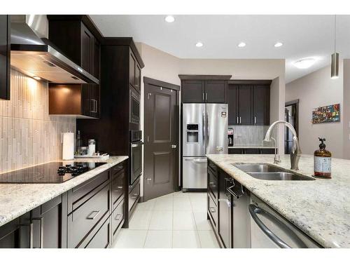 15 Cougar Ridge Manor Sw, Calgary, AB - Indoor Photo Showing Kitchen With Stainless Steel Kitchen With Double Sink With Upgraded Kitchen