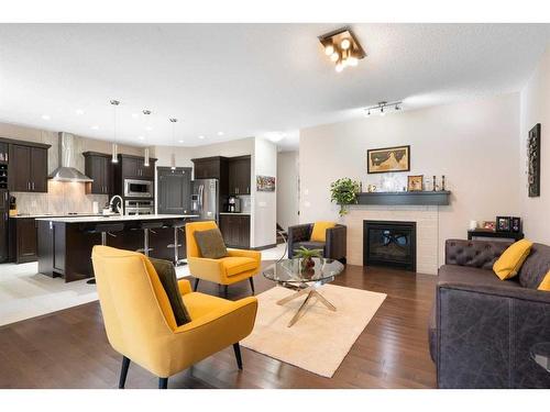 15 Cougar Ridge Manor Sw, Calgary, AB - Indoor With Fireplace