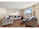 95 Rundleson Way Ne, Calgary, AB  - Indoor Photo Showing Living Room 