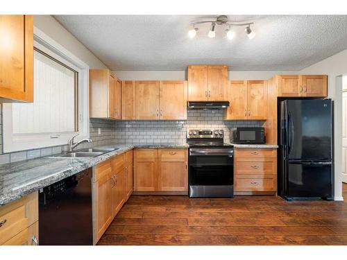 95 Rundleson Way Ne, Calgary, AB - Indoor Photo Showing Kitchen With Double Sink