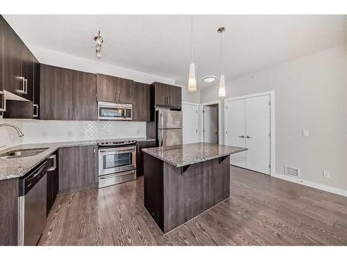 309-4 Sage Hill Terrace Nw, Calgary, AB - Indoor Photo Showing Kitchen With Stainless Steel Kitchen With Upgraded Kitchen