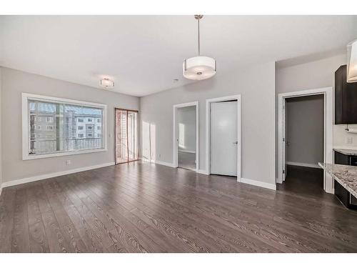 309-4 Sage Hill Terrace Nw, Calgary, AB - Indoor Photo Showing Other Room With Fireplace