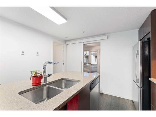 115-1719 9A Street Sw, Calgary, AB - Indoor Photo Showing Kitchen With Double Sink