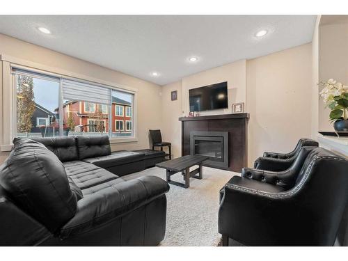 157 Aspenmere Drive, Chestermere, AB - Indoor Photo Showing Living Room With Fireplace