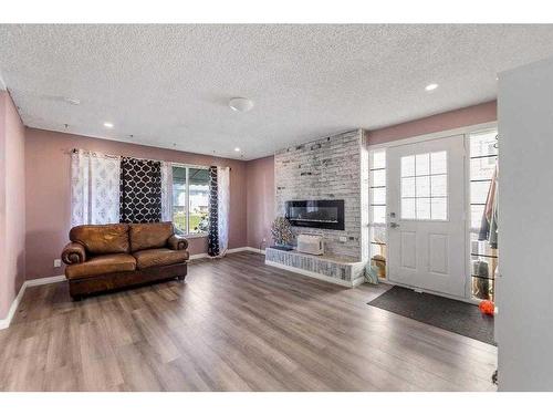 632 55 Street Se, Calgary, AB - Indoor Photo Showing Living Room With Fireplace