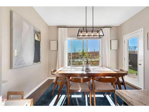 77 Fireside Cove, Cochrane, AB - Indoor Photo Showing Dining Room