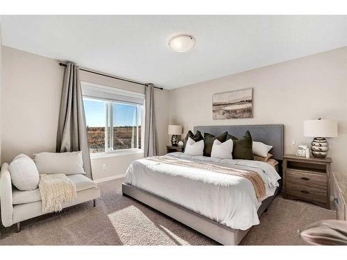 77 Fireside Cove, Cochrane, AB - Indoor Photo Showing Bedroom