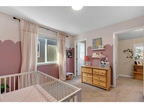 77 Fireside Cove, Cochrane, AB - Indoor Photo Showing Bedroom