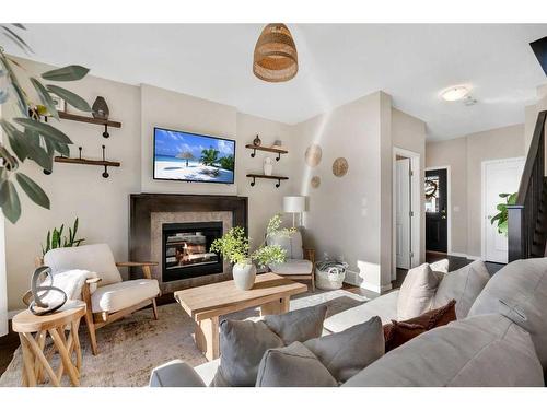 77 Fireside Cove, Cochrane, AB - Indoor Photo Showing Living Room With Fireplace