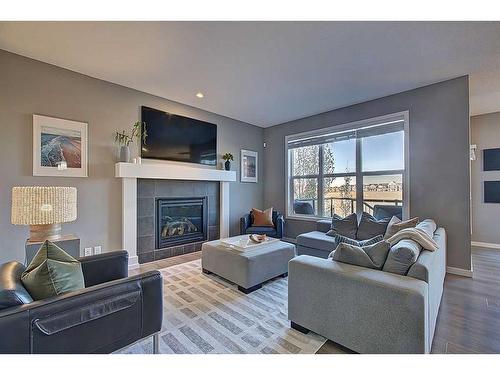 95 Evansridge Crescent Nw, Calgary, AB - Indoor Photo Showing Living Room With Fireplace