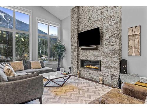 417 Stewart Creek Close, Canmore, AB - Indoor Photo Showing Living Room With Fireplace